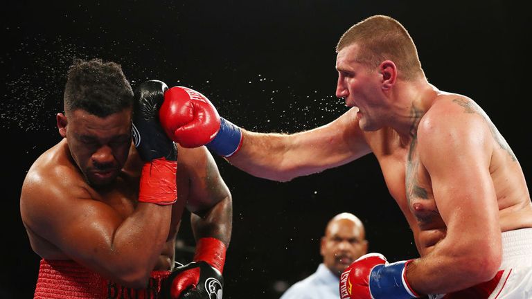 Mariusz Wach punches Jarrell Miller during their Heavyweight  bout at Nassau Veterans Memorial Coliseum on November 11, 2017