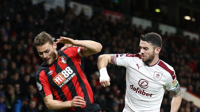 BOURNEMOUTH, ENGLAND - NOVEMBER 29: Simon Francis of AFC Bornemouth is challenged by Robbie Brady of Burnley during the Premier League match between AFC Bo
