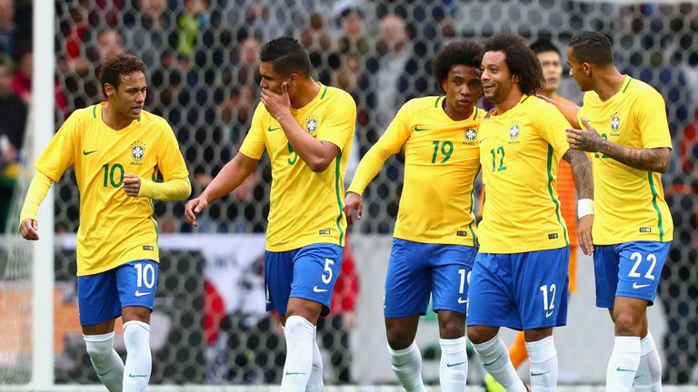 Marcelo of Brazil celebrates with team mates after scoring his sides second goal during the international friendly match betw