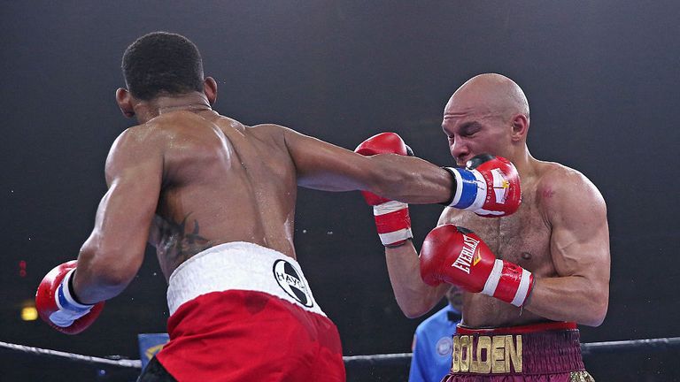 Daniel Jacobs (L) connects with Caleb Truax during a middleweight fight at the UIC Pavilion on April 24, 2015 in Chicago, Illinois.