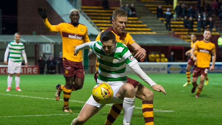 Callum McGregor goes down under the challenge of Andy Rose