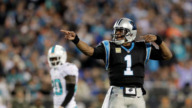 CHARLOTTE, NC - NOVEMBER 13:  Cam Newton #1 of the Carolina Panthers signals a first down against the Miami Dolphins in the first quarter during their game