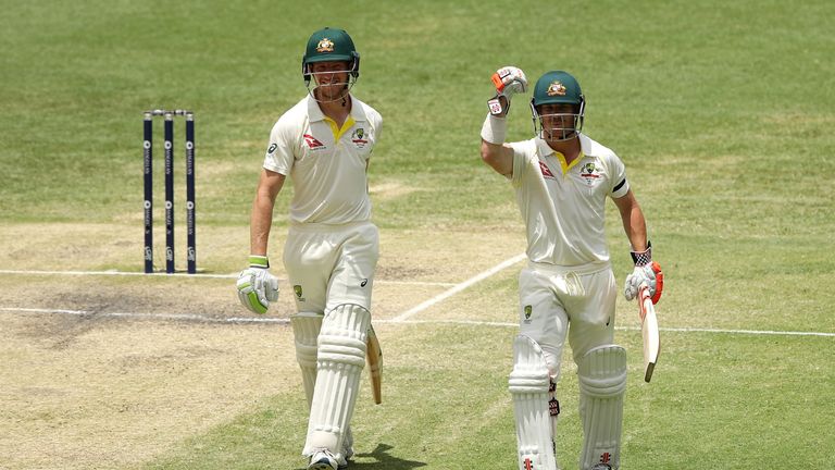 David Warner of Australia embraces Cameron Bancroft of Australia after winning the test during day five of the First Test