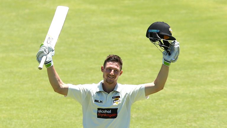 Cameron Bancroft of Western Australia raises his bat to celebrate his double century during day two of the Sheffield Shield