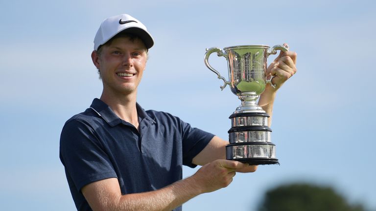 Cameron Davis of Australia poses for a photo with the trophy after victory during day four of the 2017 Australian Golf Open