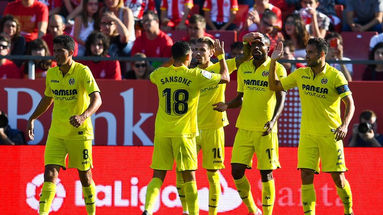 Cedric Bakambu of Villarreal CF (2ndR) celebrates with his team-mates after scoring his team's second goal during the La Liga match v Girona