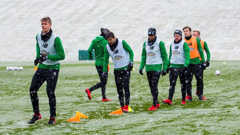 The Celtic players are put through their paces a wintry Lennoxtown  on Friday