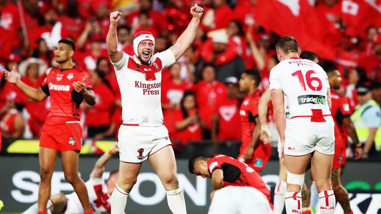 Chris Hill of England celebrates beating Tonga