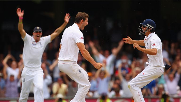 Chris Tremlett of England celebrates with team mate Alastair Cook after dismissing Michael Beer of Australia