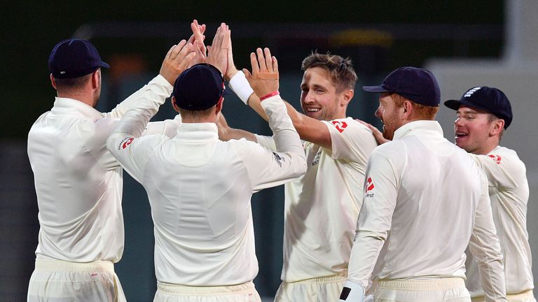 England's paceman Chris Woakes (C) celebrates his wicket of Cricket Australia XI's batsman Jake Carder on the third day of a four-day Ashes tour match