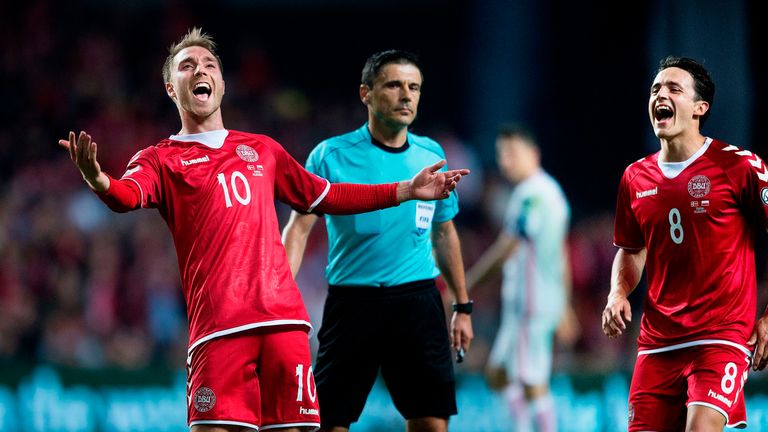 Christian Eriksen celebrates after scoring during the 2018 FIFA World Cup qualifying football match Denmark against Poland