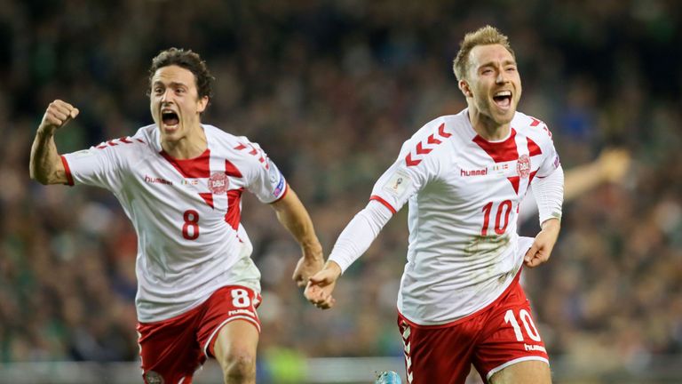 Denmark's midfielder Christian Eriksen celebrates with Denmark's midfielder Thomas Delaney (L) after scoring a goal during the FIFA World Cup 2018 qualifyi