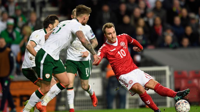 Christian Eriksen (R) of Denmark vies for the ball against Jeff Hendrick and James McClean of Ireland during the play-off FIFA World Cup 2018 qualification