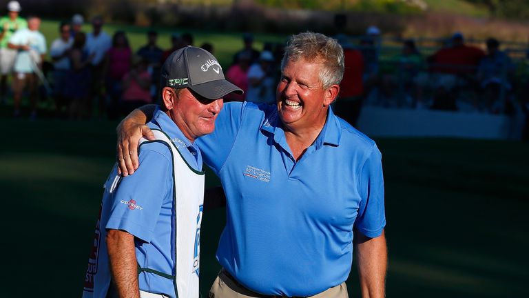 CARY, NC - OCTOBER 15:  Colin Montgomerie of Scotland celebrates with his caddie, Alastair McLean, after winning the SAS Championship at Prestonwood Countr