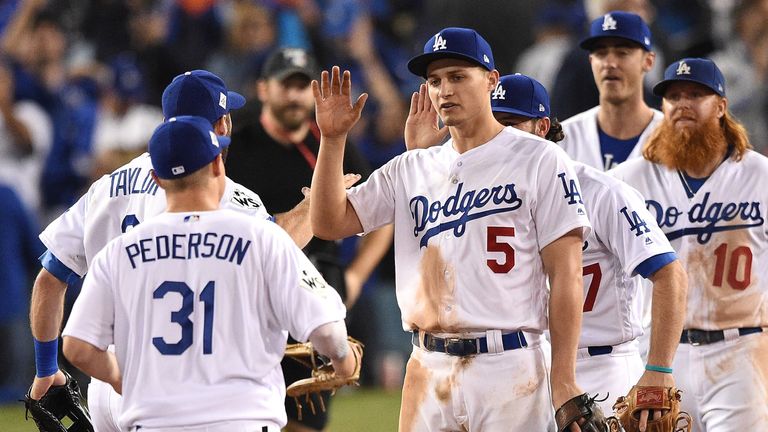 Corey Seager of the Los Angeles Dodgers celebrates with teammates after defeating the Houston Astros 3-1 in game six of the World Series