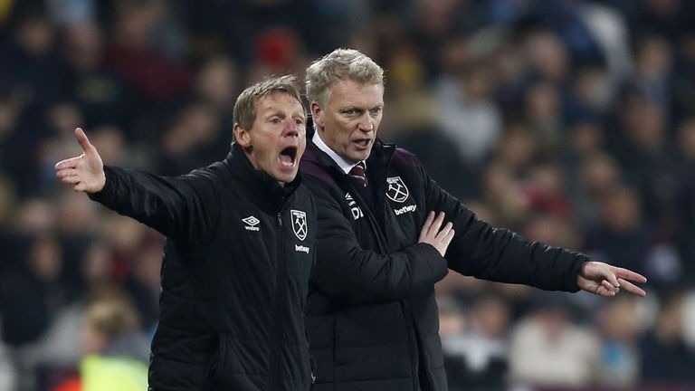 West Ham United's Scottish manager David Moyes (R)  and assistant Stuart Pearce gesture during the English Premier League footba