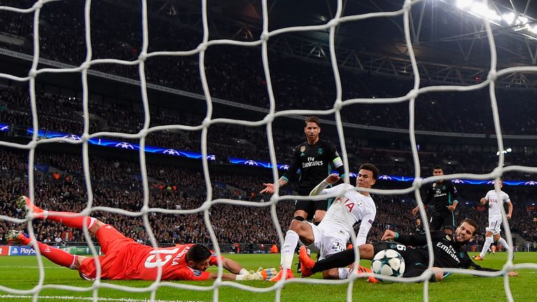 LONDON, ENGLAND - NOVEMBER 01:  Dele Alli of Tottenham Hotspur beats Francisco Casilla of Real Madrid as he scores their first goal during the UEFA Champio