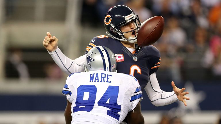 ARLINGTON, TX - OCTOBER 01:  Jay Cutler #6 of the Chicago Bears fumbles the ball as he is sacked by DeMarcus Ware #94 of the Dallas Cowboys in the third qu