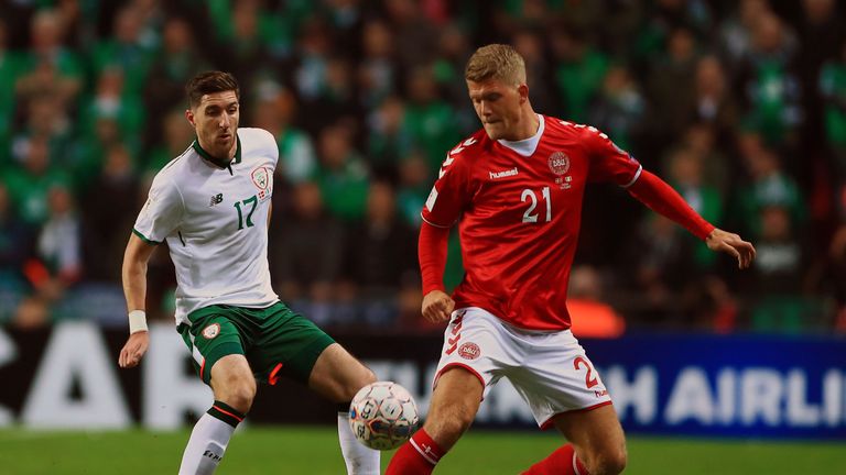 Denmark's Andreas Cornelius and Republic of Ireland's Stephen Ward (left) during the FIFA World Cup qualifying play-off first leg match at the Parken Stadi