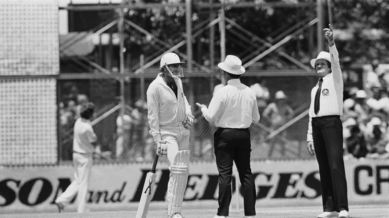 Australian cricketer Dennis Lillee talks to officials about his illegal aluminium bat during the first Test against England at Perth, December 1979