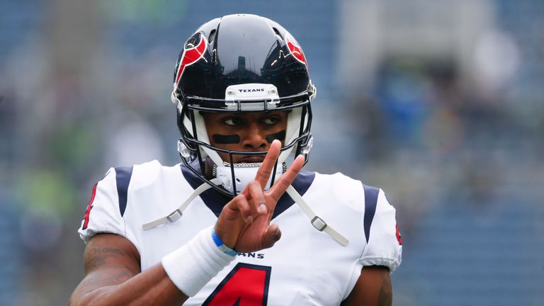SEATTLE, WA - OCTOBER 29:  Quarterback Deshaun Watson #4 of the Houston Texans makes a peace sign as he warms up on the field before the game against the S