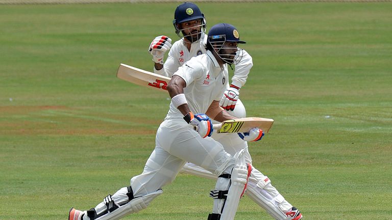 Indian cricketers Lokesh Rahul (R) and Shikhar Dhawan (L) run between the wickets during the first day of the three-day warm-up cricket match between Sri L