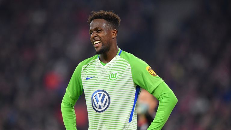 Divock Origi of Wolfsburg smiles during the Bundesliga match between FC Bayern Muenchen and VfL Wolfsburg at Allianz Arena 