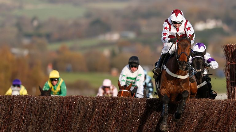 Paddy Brennan riding Doitforthevillage clear the last