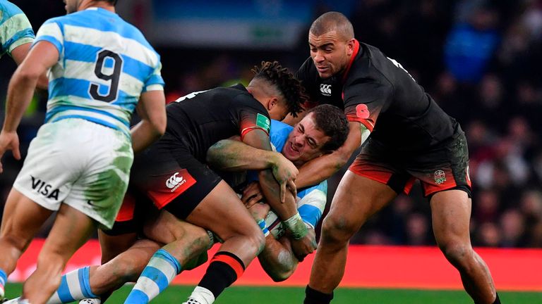 Argentina's wing Emiliano Boffelli (C) is tackled during the Autumn international