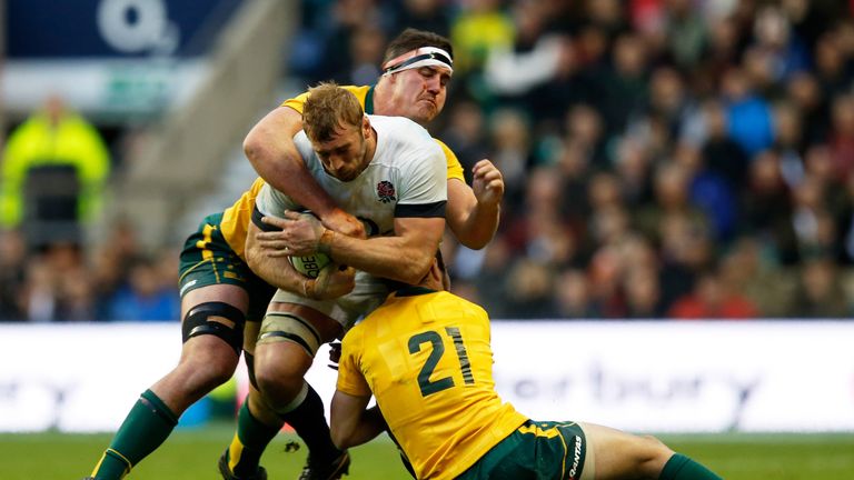 LONDON, ENGLAND - NOVEMBER 02:  Chris Robshaw of England is tackled by Kane Douglas and Nic White of Australia during the QBE International match between E