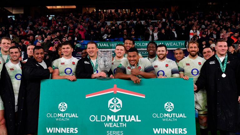 England's hooker Dylan Hartley holds the Cook Cup after beating Australia