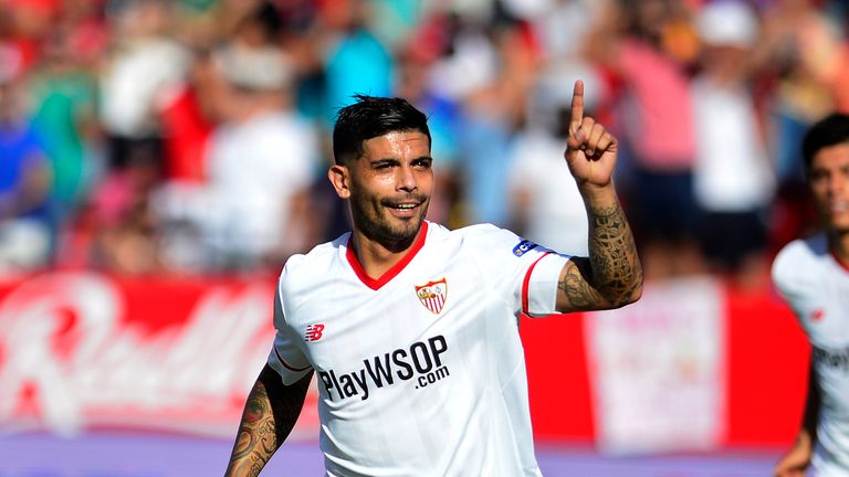 Sevilla's Argentinian midfielder Ever Banega celebrates after scoring a goal during the Spanish league football match Sevilla FC vs Malaga CF at the Ramon 