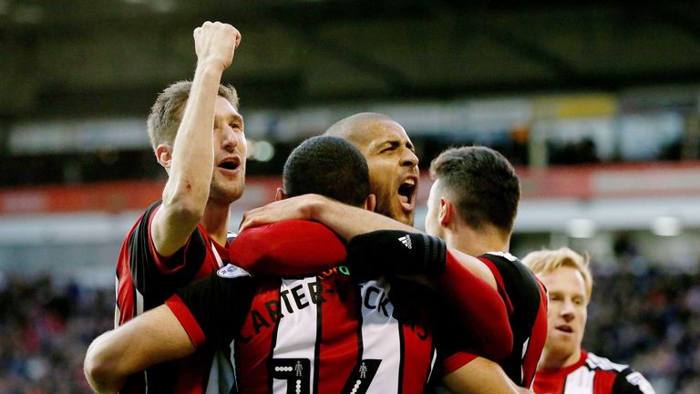 Leon Clarke (C) celebrates 53rd minute equaliser with team-mates