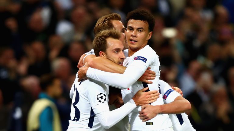 Christian Eriksen of Tottenham Hotspur celebrates scoring his side's third goal with team-mates during the UEFA Champions League match v Real Madrid