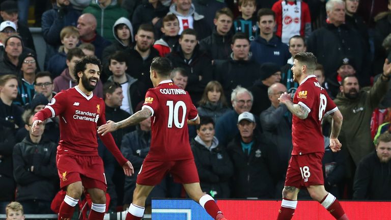 LIVERPOOL, ENGLAND - NOVEMBER 18:  Mohamed Salah (1st L) of Liverpool celebrates scoring his side's second goal with his team mates Philippe Coutinho (C) a
