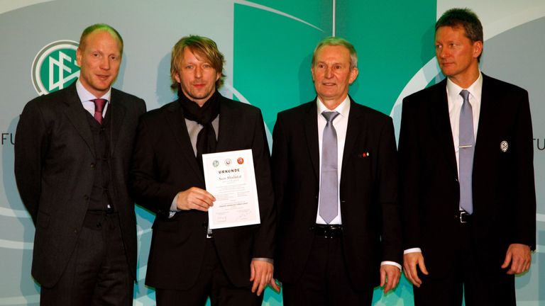 COLOGNE, GERMANY - MARCH 17:  Sven Mislintat(2f.L) receive his DFB Football Trainer Certificate from  Matthias Sammer (L), Rainer Milkoreit