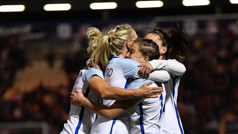 England's Fran Kirby of England (2R) celebrates with her team-mates after scoring from the penalty spot