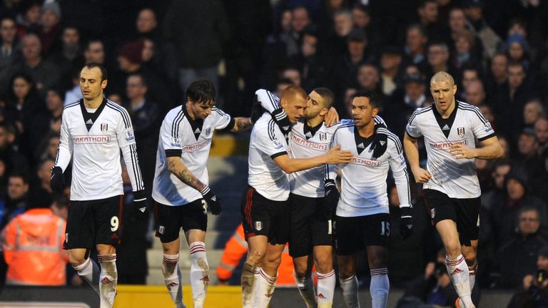 Steve Sidwell of Fulham is kissed by teammate Adel Taarabt  after scoring a goal to level the scores at 1-1