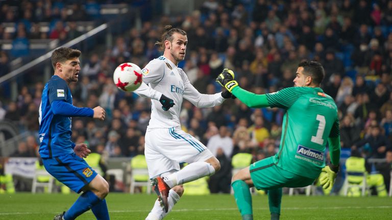 MADRID, SPAIN - NOVEMBER 28: Gareth Bale of Real Madrid CF shoots past Pol Freixanet  of Fuenlabrada during the Copa del Rey, Round of 32, Second Leg match