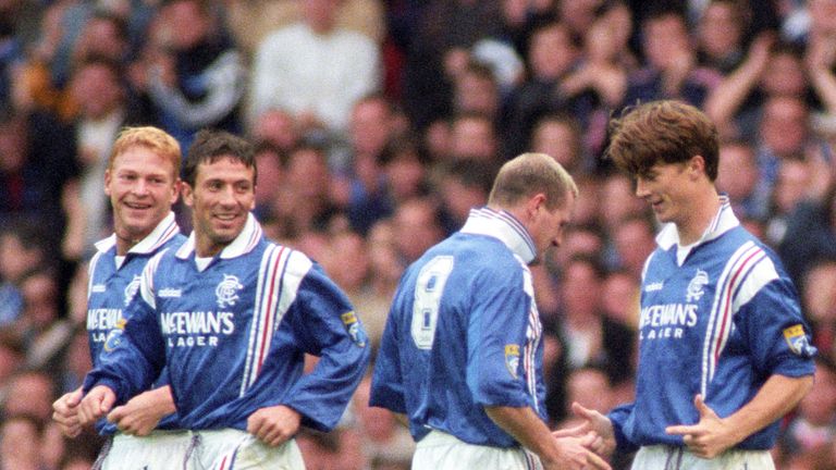 Brian Laudrup (right) celebrates his first goal with Paul Gascoigne as Derek McInnes