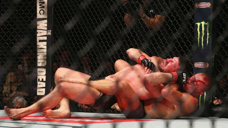NEW YORK, NY - NOVEMBER 04:  Michael Bisping of England is pinned by Georges St-Pierre of Canada in their UFC middleweight championship bout during the UFC