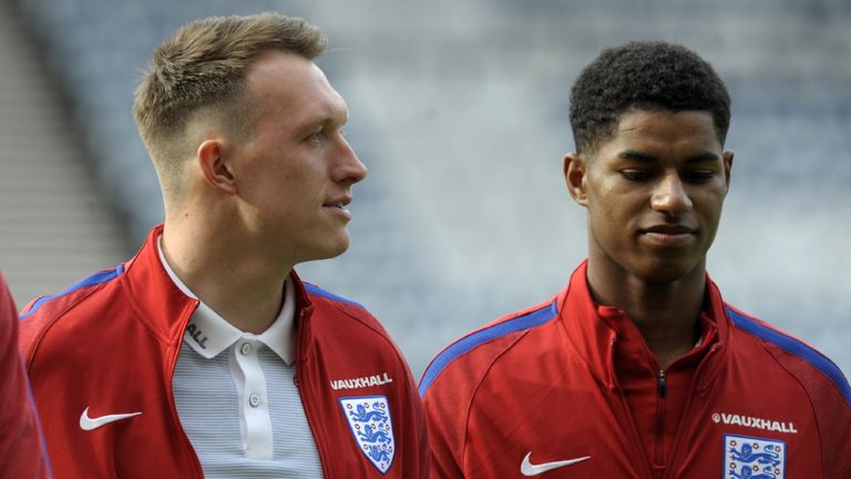 England's defender Phil Jones (L) and England's striker Marcus Rashford