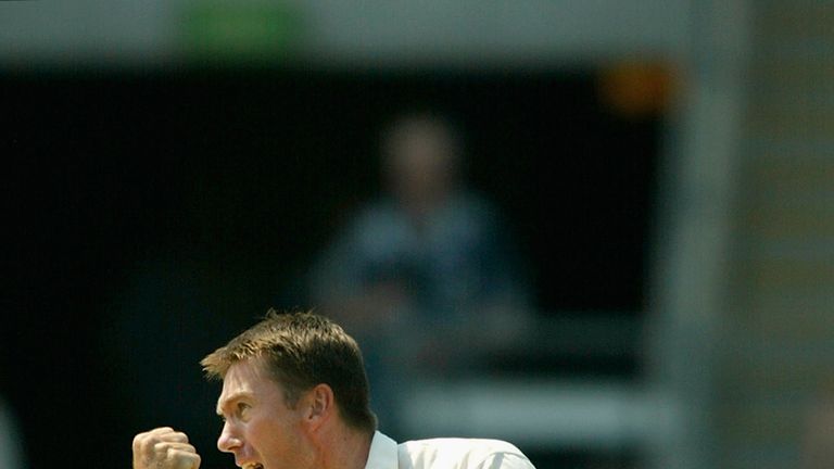 Glenn McGrath of Australia celebrates the wicket of Michael Vaughan during day four of the First Ashes Test