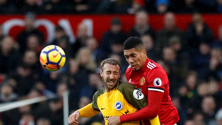 Glenn Murray and Chris Smalling in action at Old Trafford