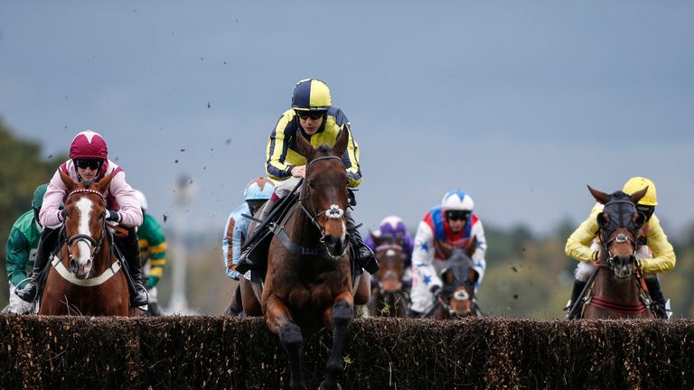 Aidan Coleman riding Go Conquer (C) lead all the way to win the Sodexo Gold Cup Handicap Steeple Chase at Ascot racecourse