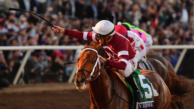 Gun Runner ridden by Florent Geroux (#5) defeats Collected to win the Breeders' Cup Classic at Del Mar