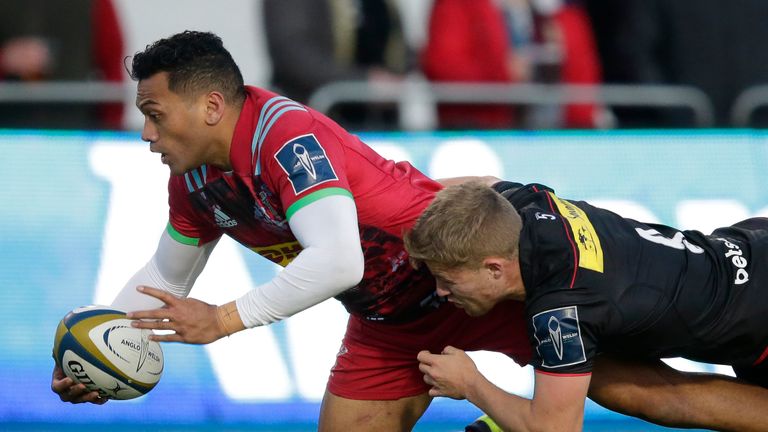 Alofa Alofa of Harlequins  stretches beyond Ben Earl of Saracens during the sides Anglo-Welsh Cup round one match