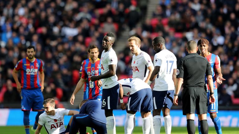 LONDON, ENGLAND - NOVEMBER 05: Harry Winks of Tottenham Hotspur receives treatment from the medical team during the Premier League match between Tottenham 