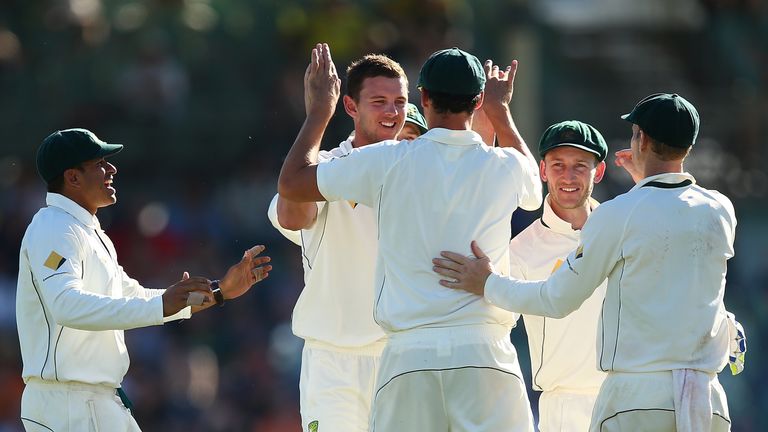 PERTH, AUSTRALIA - NOVEMBER 05: Josh Hazlewood and Mitchell Starc of Australia celebrates the wicket of Dean Elgar of South Africa during day three of the 