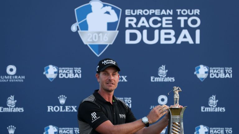 Henrik Stenson of Sweden poses with his trophy after winning the Race to Dubai at the end of the DP World Tour Championship at Jumeirah Golf Estates in Dub